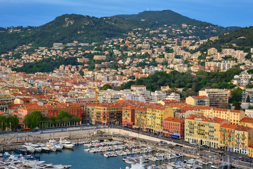 Nice yacht charter at Old Port of Nice with luxury yachts and panoramic harbor view French Riviera