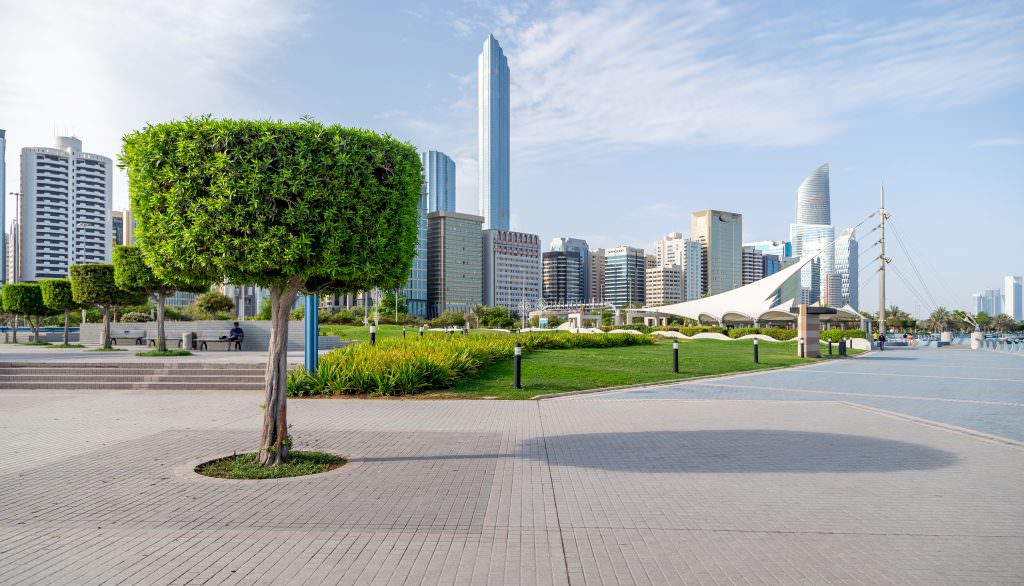 Luxury Abu Dhabi Corniche yacht charter city skyline and waterfront park view