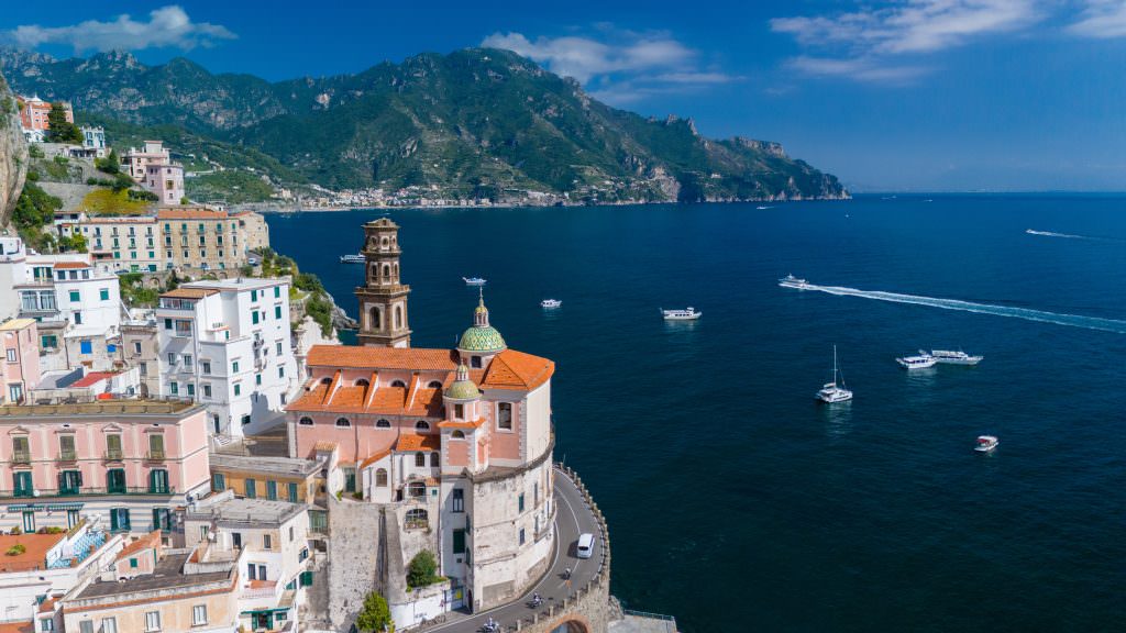 Amalfi Coast yacht charter in italy with sea view church and coastal town scenery
