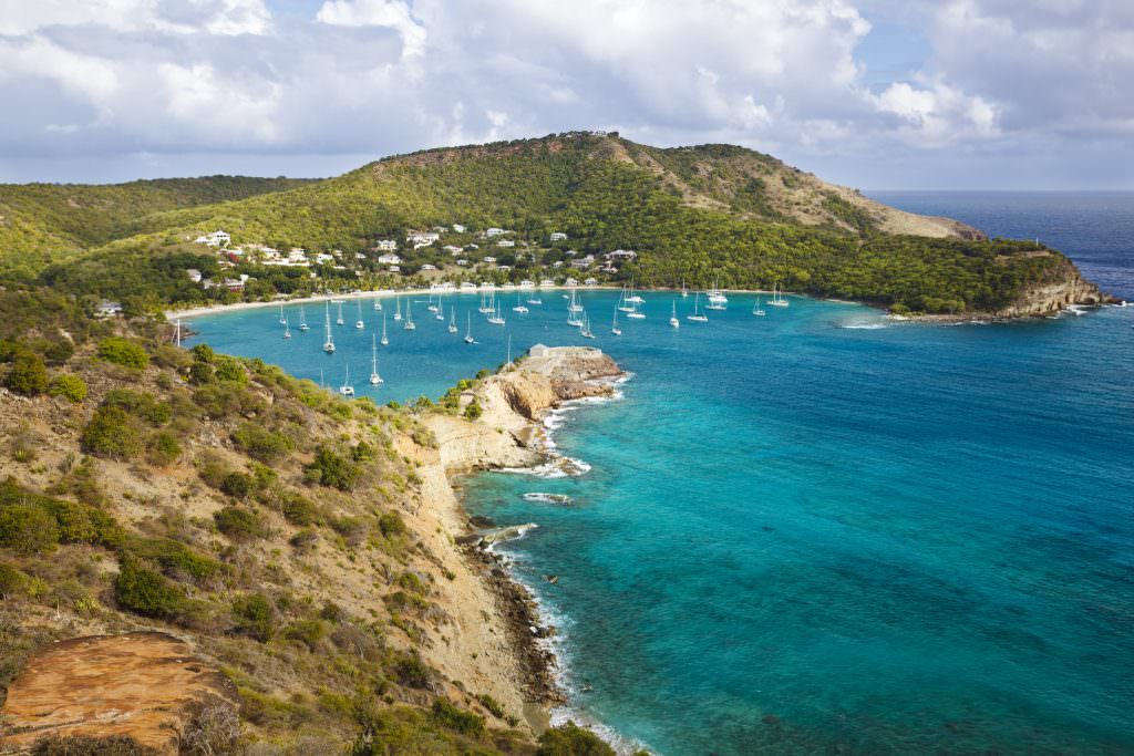 Luxury yacht charter Antigua Barbuda turquoise bay Caribbean view