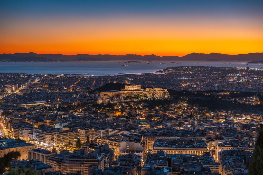 Luxury yacht charter in Athens with Acropolis sunset skyline aerial view
