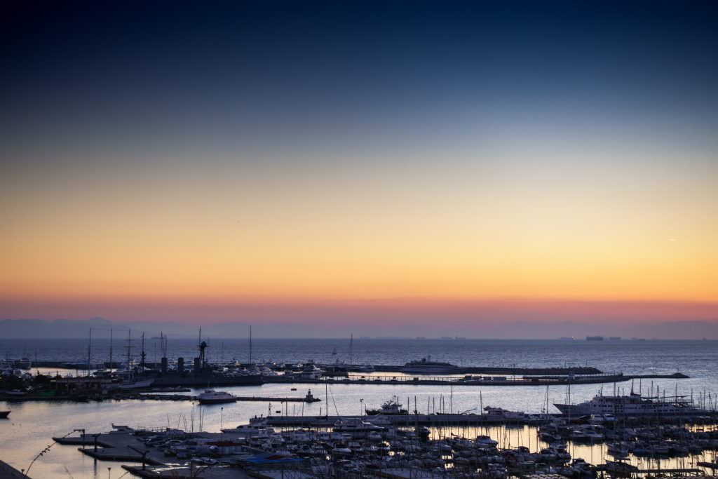 Athens yacht charter in marina at sunset with yachts in harbor