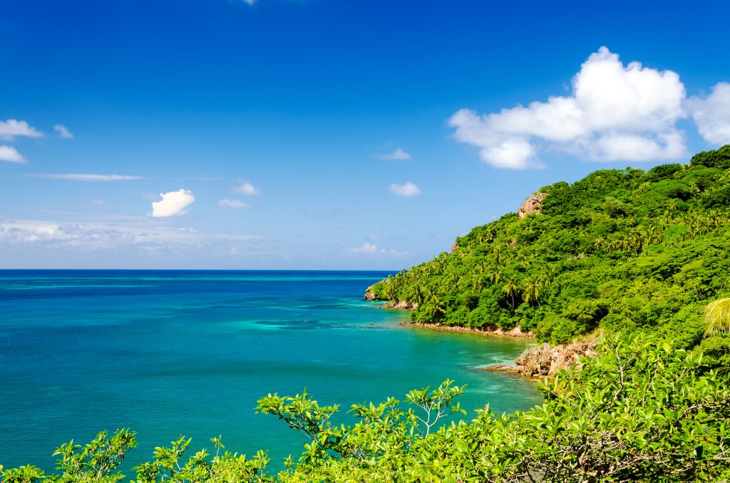 Caribbean tropical island coastline luxury yacht charter destination