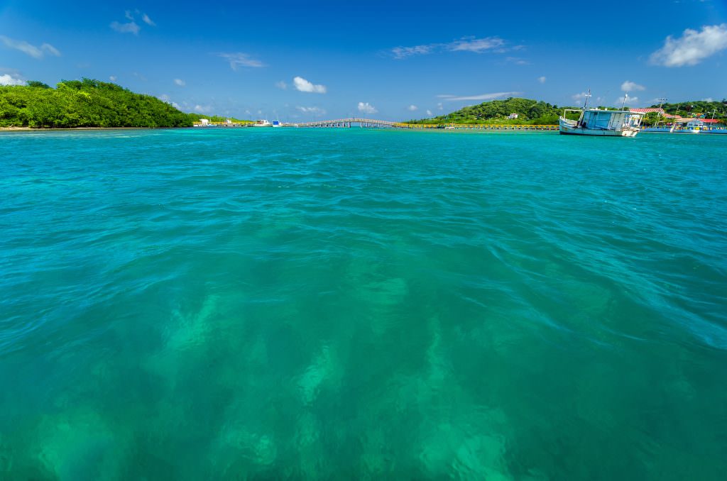 Caribbean yacht charter white sand beach turquoise water luxury experience