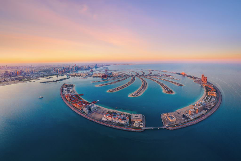 Dubai luxury yacht charter Palm Jumeirah aerial view Arabian Gulf iconic island