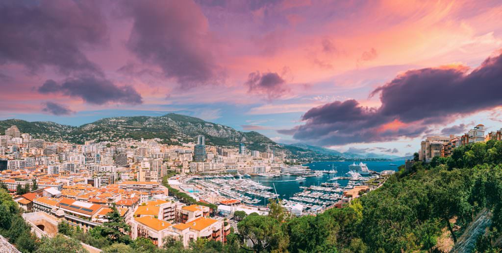 Monte Carlo Marina Monaco panoramic city view with luxury yachts Mediterranean yacht charter destination