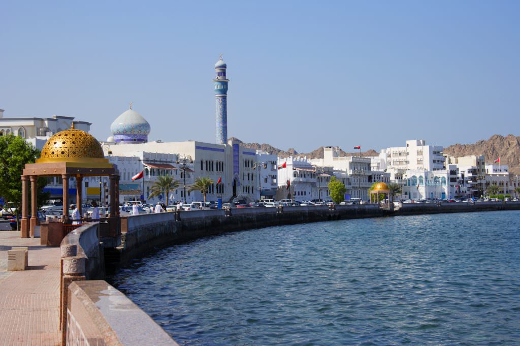 Luxury Muscat Oman yacht charter Muttrah Corniche waterfront with mosque and city view