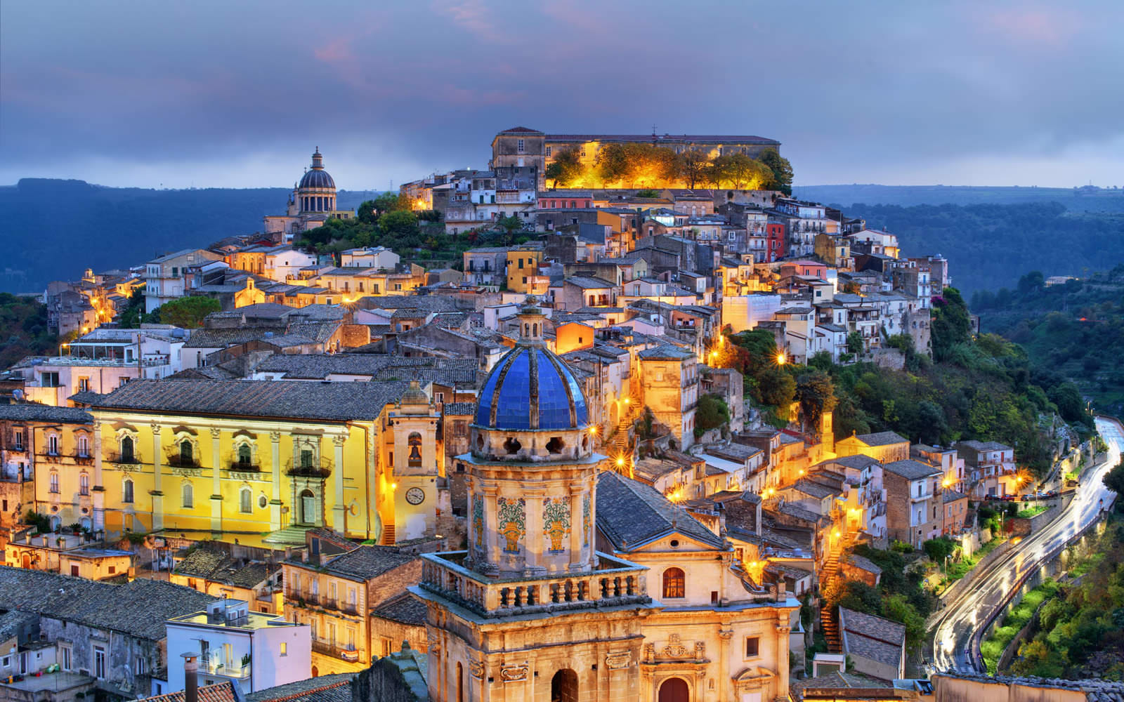 Historic Italian town illuminated at night in Sicily