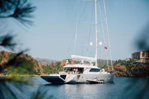 Kaira Yachts – All About U 2 luxury yacht anchored in a secluded bay