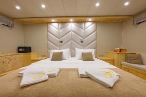 Belgin Sultan master cabin front view with luxury double bed, elegant interior design and yacht accommodation details