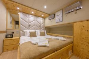 Belgin Sultan master cabin interior with double bed, modern luxury yacht accommodation design