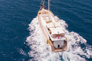Belgin Sultan motor sailor cruising on open sea with aerial view, luxury