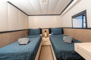 Calm Down luxury yacht charter twin cabin with two single beds modern interior design