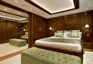 Clear Eyes gulet VIP cabin, luxury yacht spacious double bedroom with elegant wooden interior, premium bedding and refined design for an exclusive onboard experience