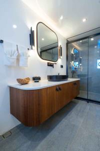 De Love motor sailer ensuite bathroom with modern design, luxury yacht charter shower cabin and elegant vanity with premium finishes