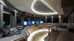 Luxury yacht bridge control room with navigation systems and captain area