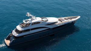 Luxury yacht LA PASSION aerial view in deep blue sea showing full deck layout