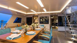 Luxury yacht LA PASSION outdoor dining evening deck experience