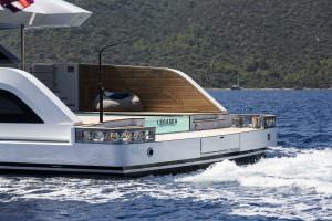 Legasea luxury yacht charter aft detail with teak deck, sea view and coastal landscape