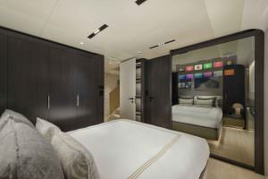 Legasea luxury yacht cabin interior with mirror view, double bed and modern wardrobe design