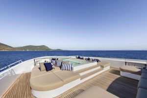 Legasea luxury yacht sundeck jacuzzi area with sunbeds, sea view and relaxation lounge