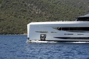 Legasea superyacht side profile cruising along coastline, ultra luxury yacht charter experience