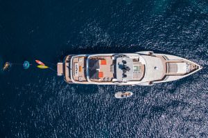 Luxury yacht aerial view with jet ski and water toys on deck