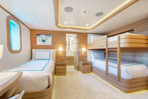 Luxury yacht MOCA family cabin with bunk beds and single bed layout