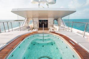 Luxury yacht MOCA jacuzzi deck with panoramic sea view and sunbeds