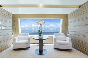 Luxury yacht MOCA lounge seating area with panoramic sea view and elegant design