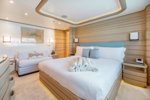 Luxury yacht MOCA master cabin with king size bed and elegant interior design