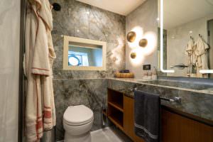 North Wind motor sailer bathroom detail, luxury yacht interior with marble walls, elegant vanity design and premium finishes