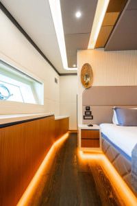 North Wind motor sailer cabin side detail, luxury yacht interior with ambient lighting, modern bedside design and elegant finishes