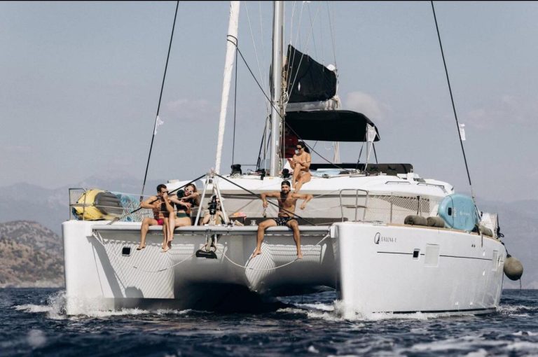 La Luna 1 catamaran charter side profile on water